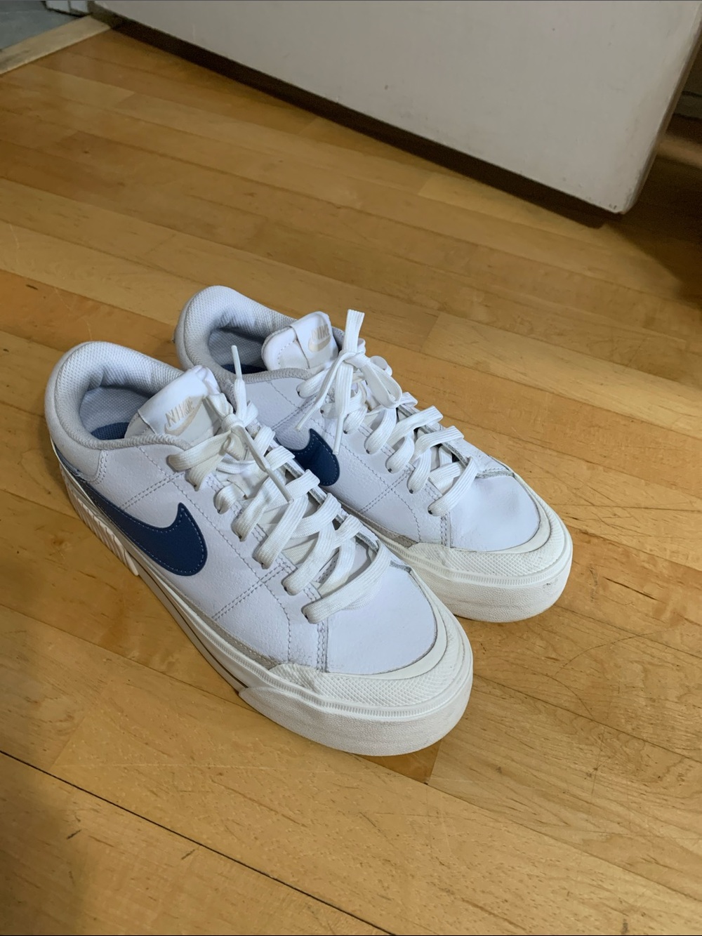 Nike Women’s White Sneakers with Navy Swoosh